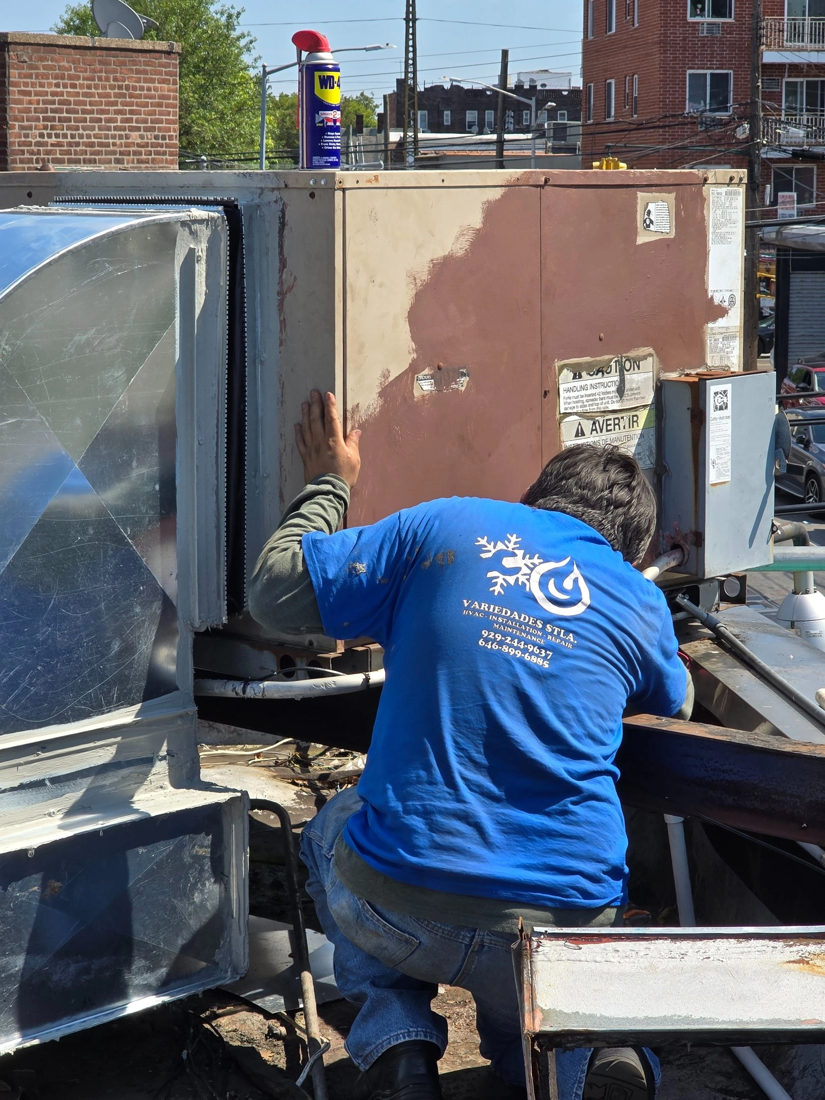 Tech Repairing AC Unit